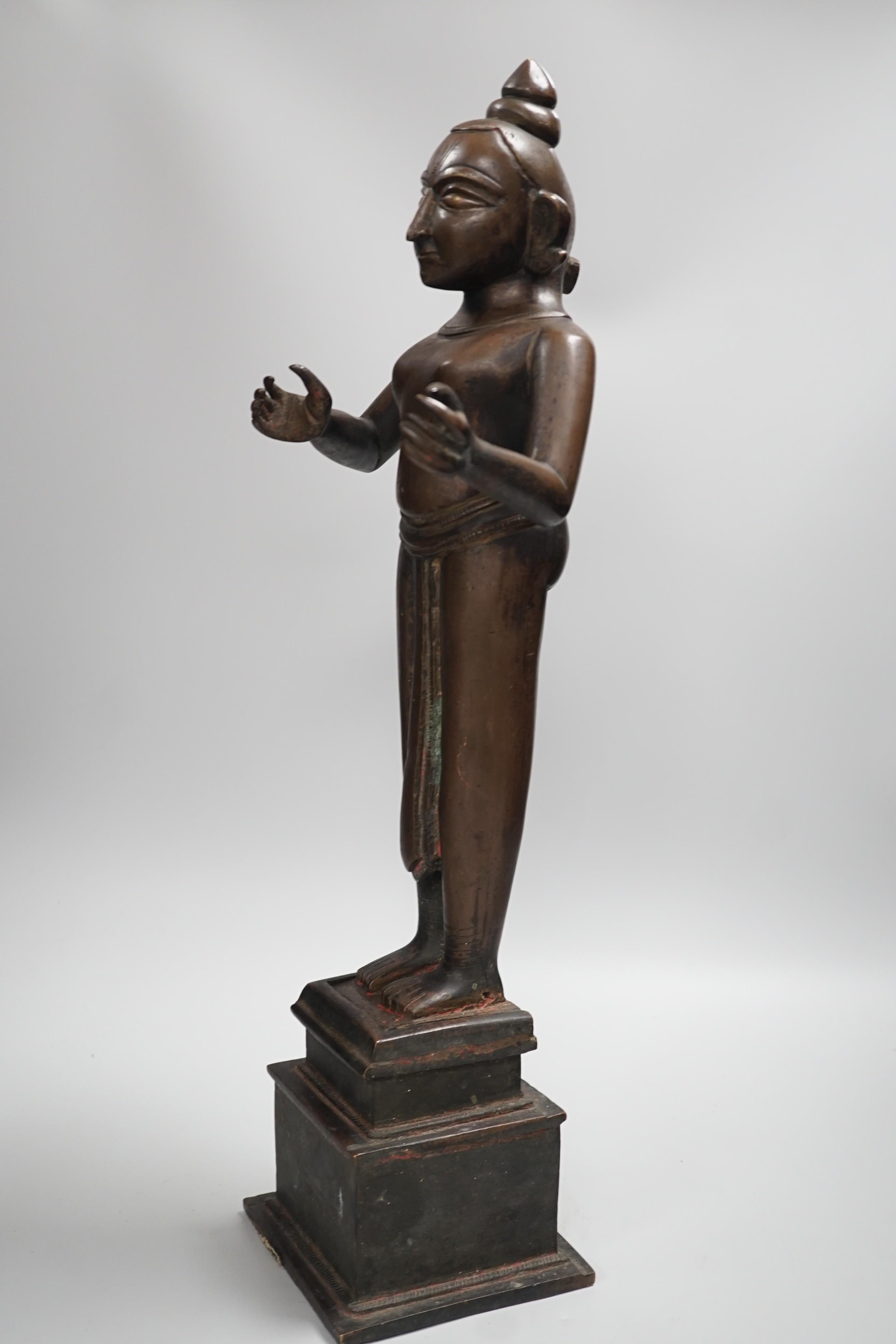 A large and heavy 19th century Indian bronze figure of Radha with separate bronze pedestal, total height 56cm